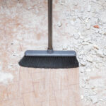 Broom,Sweeping,Concrete,Pieces,From,Floor.,Cleaning,Garbage,After,Repair