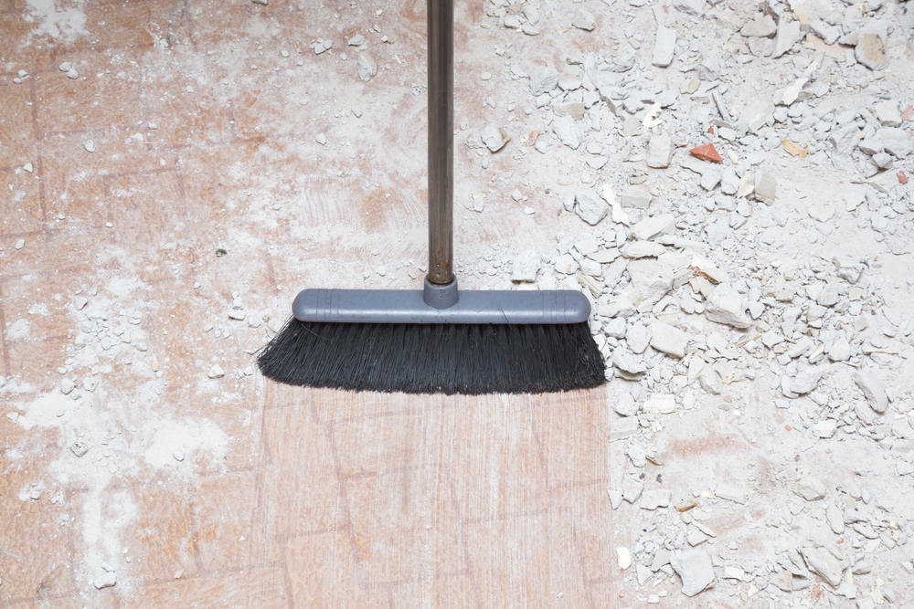 Broom,Sweeping,Concrete,Pieces,From,Floor.,Cleaning,Garbage,After,Repair