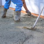Concrete,Leveling,Workers,On,Construction,Site,With,Mix,Trowel,Leveling